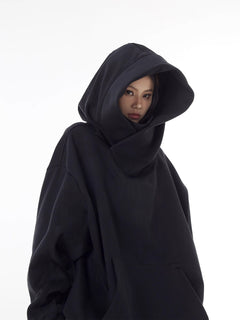 Oversized black hoodie with large hood, cozy streetwear style for women