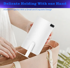 Compact smart projector held in hand, fitting easily into a purse for portable home entertainment