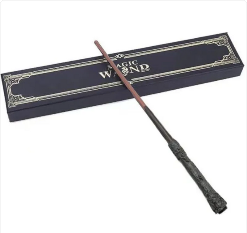Magic wand with ornate handle, displayed beside elegant gift box for fantasy-themed gifts