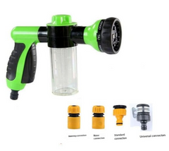 Green and black garden hose spray gun with soap dispenser and universal connectors for outdoor cleaning