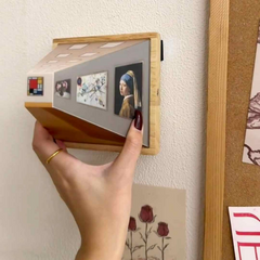 Wooden wall-mounted art display with mini famous paintings, perfect for home decor and gift ideas