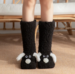 Cozy black fuzzy slipper socks with cute white bunny faces, perfect for home comfort and gifts
