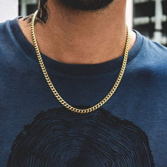 Gold curb chain necklace for men, stylish everyday accessory worn with blue tee
