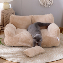 Fluffy beige cat sofa bed with gray kitten playing, cozy pet furniture for home