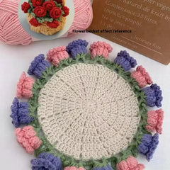 Crochet flower coaster with pink and purple blooms, handmade gift idea for home decor