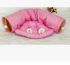 Pink patterned pet bed with cozy tunnels and soft white accents, perfect for cats or small dogs