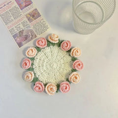 Handmade crochet coaster with pink and peach roses, perfect for home decor or gifting