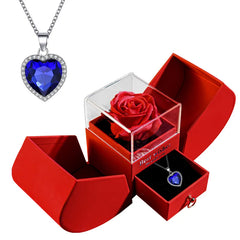 Heart-shaped blue gemstone necklace with red rose in gift box, perfect romantic gift for her