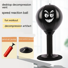 Black desktop punching ball with funny face, fun workout stress relief for home or office