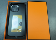 Black phone case with panda design and 'Hello, world!' text in orange gift box