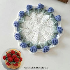 Crocheted doily with blue rose accents, floral basket effect reference shown