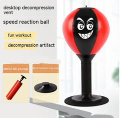 Red and black desktop punching ball with angry face, suction base, air pump for fun stress relief workout