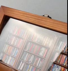 Wooden-framed glass display case filled with colorful CD collection, perfect gift for music lovers