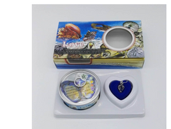 Heart-shaped blue pendant with gift box featuring ocean-themed design